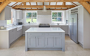 A handmade shaker style kitchen island in light grey colour