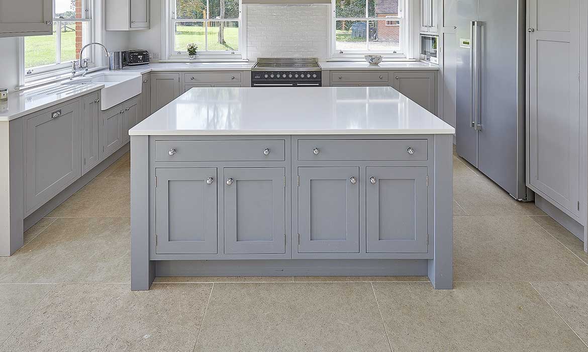 Large light grey shaker style kitchen island