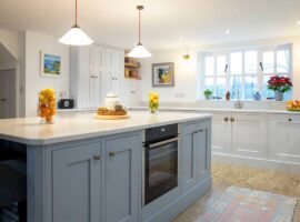 Large shaker kitchen with centre island by Chiddingfold Kitchens